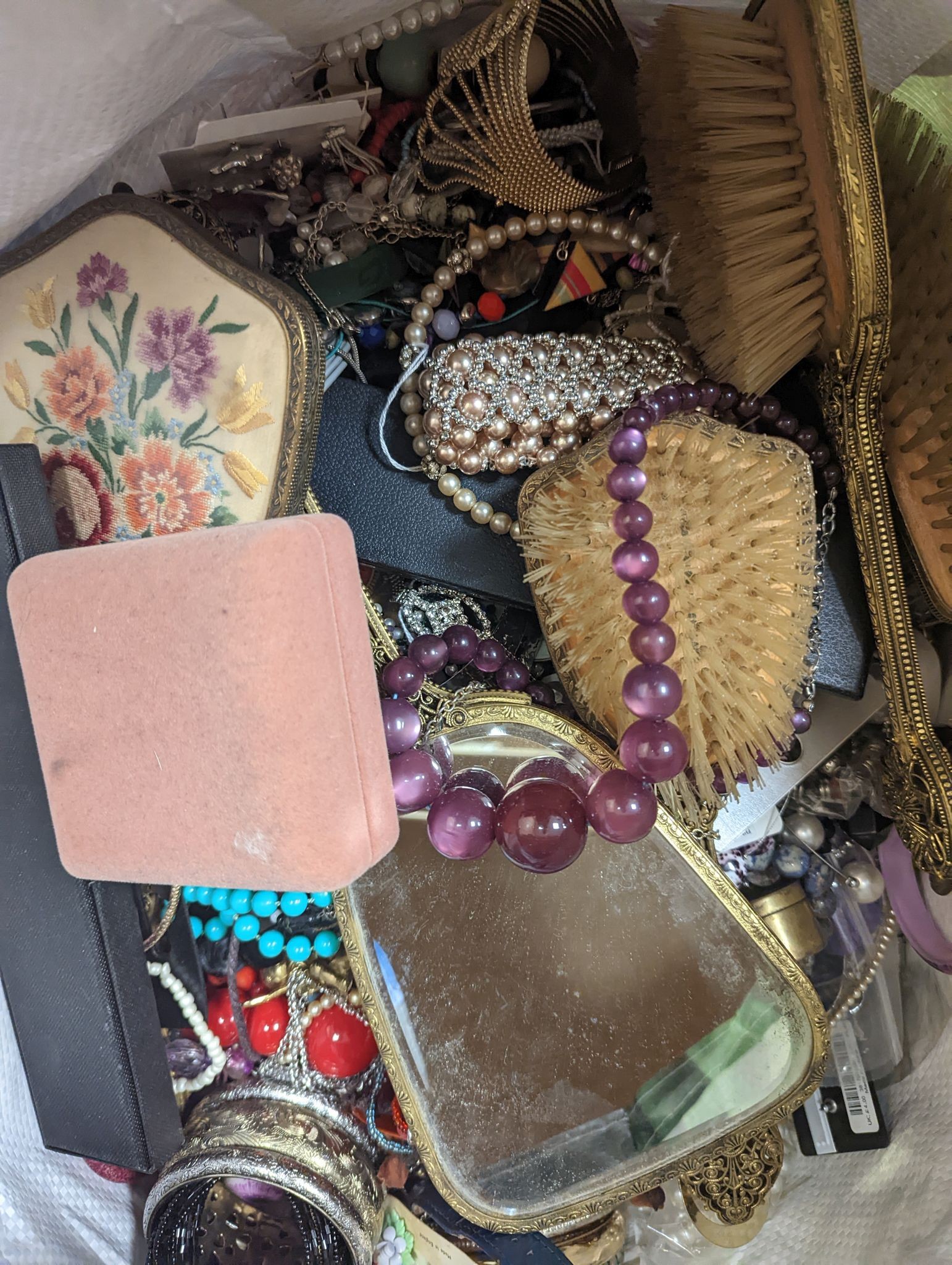 Three large bags of vintage costume jewellery.